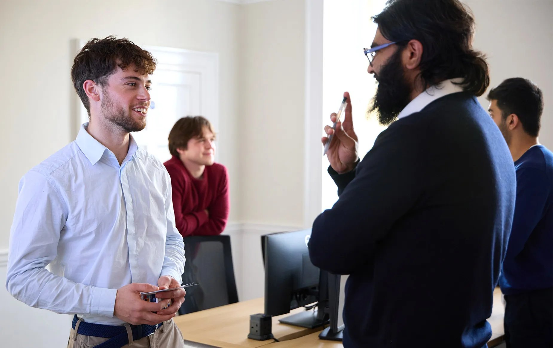 Students in discussion with their peers and mentors